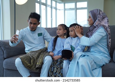 Eid Mubarak Celebration Moment, Malay Family Taking A Selfie.