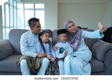 Eid Mubarak Celebration Moment, Malay Family Taking A Selfie.