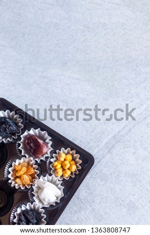 Eid Mubarak. Different iftar sweets. Celebrating Eid Al Adha. Islamic traditional holiday. Eid al-Fitr. Holly Ramadan. Middle East religious holiday. Iftar table decorated dried date fruit and sweets.