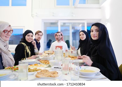 Eid Mubarak Muslim Family Having Iftar Dinner  Eating Traditional Food During Ramadan Feasting Month At Home. The Islamic Halal Eating And Drinking Islamic Family