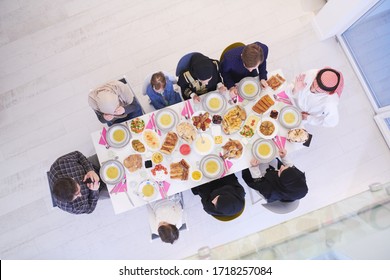 Eid Mubarak Muslim Family Having Iftar Dinner  Eating Traditional Food During Ramadan Feasting Month At Home. The Islamic Halal Eating And Drinking Islamic Family Top View