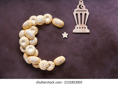 Eid mubarak with traditional semolina maamoul cookies arranged in shape of crescent moon. Eid al Adha, Eid al Fitr , Ramadan kareem concept. Top view, copy space	                               - Powered by Shutterstock