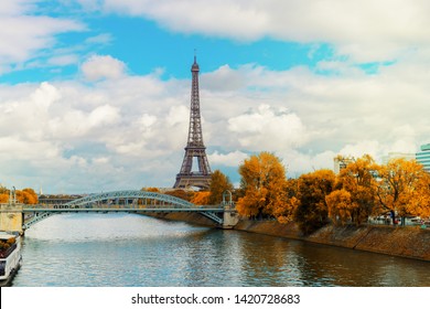 Eiffel Tour Over Seine River With Yellow Trees, Paris, France At Fall