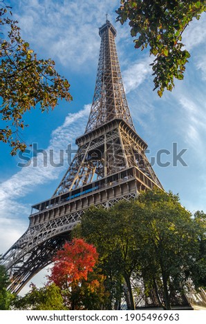 Similar – Eiffel Tower in green trees on blue sky