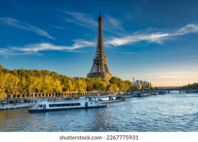 Eiffel Tower by the Seine River in Paris at summer. France - Powered by Shutterstock