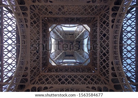 Eiffel Tower complex lattice work as viewed from underneath

