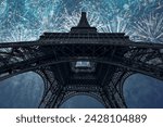 Eiffel tower with fireworks at night  in Paris, France. The Eiffel tower is the most visited touristic attraction in France