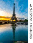 Eiffel Tower, French: Tour Eiffel, silhouette at sunrise time on sunny day. View from Seine River. Paris, France