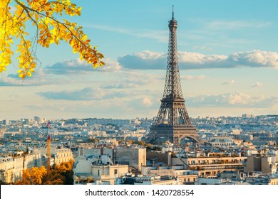 Eiffel Tower iconic landmark and Paris old roofs, Paris France at fall