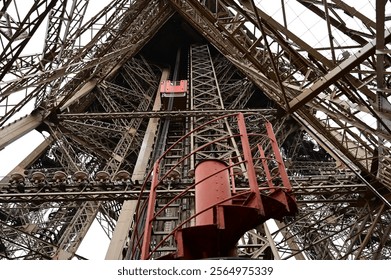 Eiffel Tower interior and elevators. Beautiful steel structure.