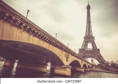 Eiffel Tower And Jena Bridge In A Cloudy Day