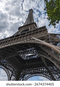 The Eiffel Tower from a low angle view, showcasing its intricate iron structure.