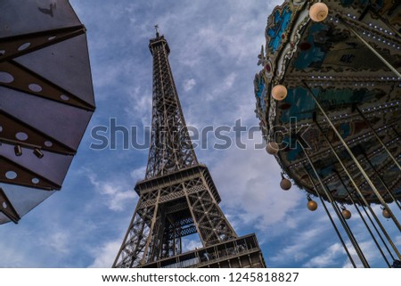 Eiffel Tower with merry go round in Paris, France