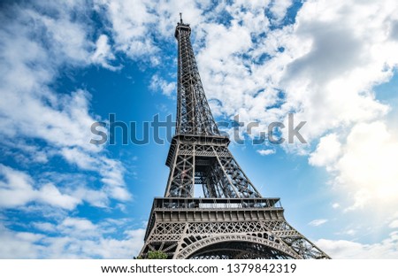 Similar – Eiffel Tower in green trees on blue sky