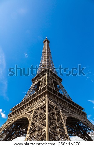 Similar – Eiffel Tower in green trees on blue sky