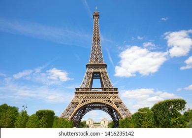 Eiffel Tower in Paris in a sunny summer day, blue sky in France - Powered by Shutterstock