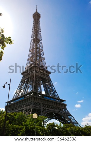 Similar – Eiffel Tower in green trees on blue sky