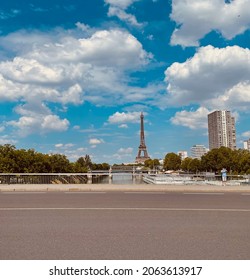 Eiffel Tower Perspective Under The Cloudy Skies