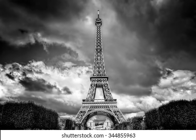 Eiffel Tower seen from Champ de Mars park in Paris, France. French Tour Eiffel in black and white