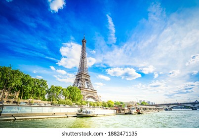 Eiffel Tower and Seine riverbank at summer day, Paris, France with sunshine