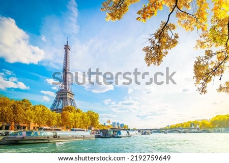 Eiffel Tower and Seine riverbank at summer day, Paris, France at fall with sunshine