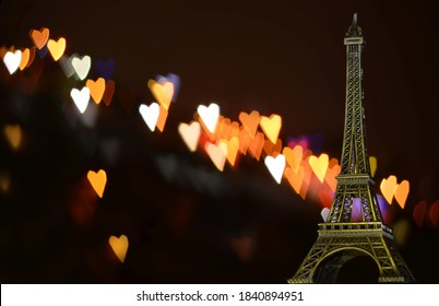 Eiffel Tower Souvenir And Small Bokeh Hearts

