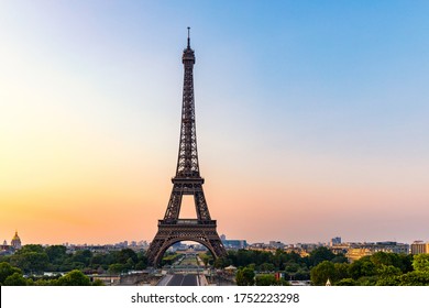 Eiffel tower in summer, Paris, France. Scenic panorama of the Eiffel tower under the blue sky. 