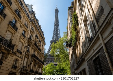 The Eiffel Tower view between palaces in Rue de l'Universite street, 7th arrondissement, Paris, France