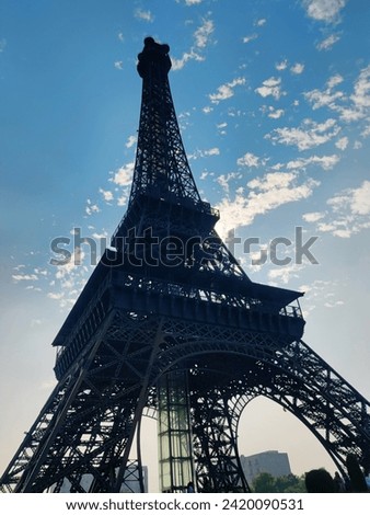 The Eifle Tower With Cloudy Background