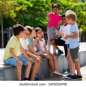 Eight Children Are Talking About Play On Walk In The Park