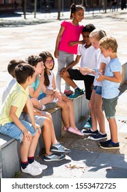 Eight Children Are Talking About Play On Walk In The Park