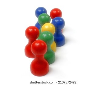 Eight Colorful Wooden Skittles Against A White Background