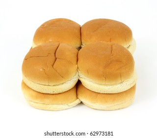 Eight Freshly Baked Hamburger Buns On A White Background.