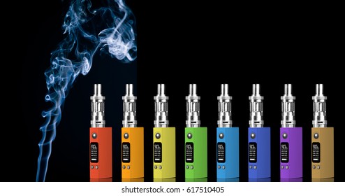 Eight multicolored electronic cigarettes and smoke - isolated on black background.