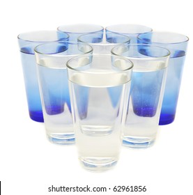 Eight Tall Glasses Of Water On A White Background.