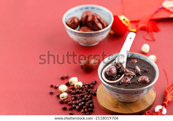 Eight Treasure Congee, Traditional Chinese\
Festive Porridge, Laba Festival, lantern Festibal, Chinese New\
Year. Copy Space for Text, Red\
Concept
