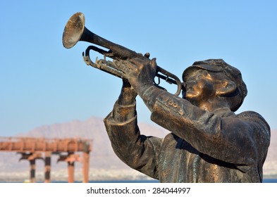 EILAT, ISR - APRIL 15 2015: An Outdoor Sculpture Of A Trumpet Jazz Player In Eilat, Israel. Red Sea Jazz Festival Held Annually In Eilat And Draws 70,000 Audiences From Israel And Around The World.