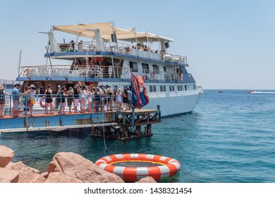 Eilat , Israel. 14.06.2019.Tourist Pier Eilat . Tourists Climb Aboard A Pleasure Boat .