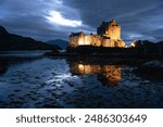 Eilean Donan castle al night. Castle near Isle of Skye. Reflection picture. Highlands of Scotland. Scotland, United Kingdom. 