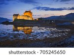 Eilean Donan Castle at Kyle reflecting itself into the water of Loch Duich and loch Alsh, during evening low tide in the Western Highlands of Scotland near Skye, UK.