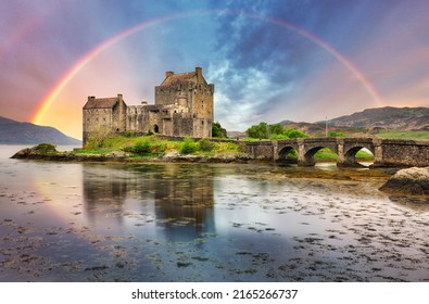 Eilean Donan Castle with rainbow and reflection in water, Scotland.