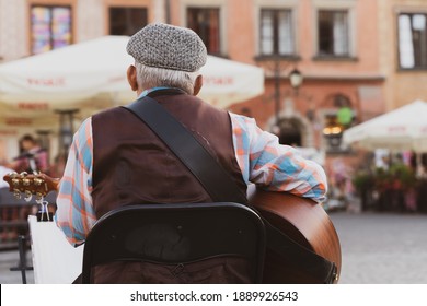 Ein Old Man Playing Guitar, Rear View.