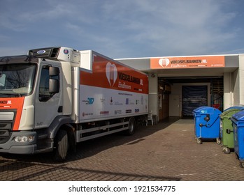 Eindhoven, The Netherlands -February 21 2021: Voedselbank, Dutch Charity Food Bank. Distribution Point Centre Voedselbanken, Truck In Front. Part Of A Serie.