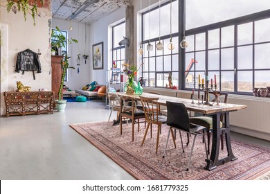 Eindhoven, the Netherlands, February 2nd 2020. An industrial city loft interior. A bohemian, modern, mix and match eclectic styled home with big factory windows. Home decoration inspiration