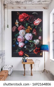 Eindhoven, the Netherlands, February 2nd 2020. An interior of a spacious industrial city loft on Strijp S with a high ceiling and big painting. A bohemian, modern, mix and match eclectic styled home 