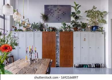 Eindhoven, the Netherlands, February 2nd 2020. An industrial city loft interior. A bohemian, modern, mix and match eclectic styled home with plants and flowers and a big closet. Home deco inspiration