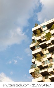 
Eindhoven, The Netherlands, June 29th 2022. Vertical forest garden tower detail with trees creating more greenery and nature for the social housing residents of the city, Strijp S district. Blue sky