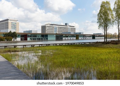 Eindhoven, The Netherlands, May 3rd 2021. High Tech Campus exterior buildings with the Philips headquarters, a lake and greenery on a sunny day during spring