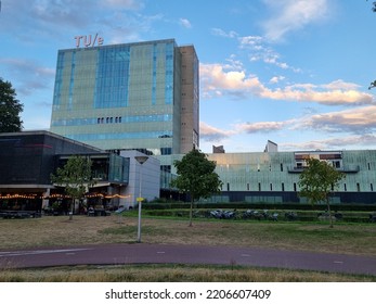 Eindhoven, The Netherlands - September 7 2022: The Vertigo Building From The Technical University Of Eindhoven In The Netherlands. A Blue Cloud Sky In The Background. The TUE Sign On The Top.