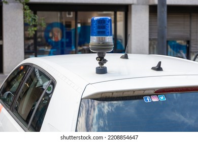 Eindhoven - September 30 2022: Blue Flashlight On Police Car. Stickers Social Media Facebook, Instagram Twitter On Rear Window. Cybercrime On Internet Laptop Or Smartphone. Security And Report. Serie.